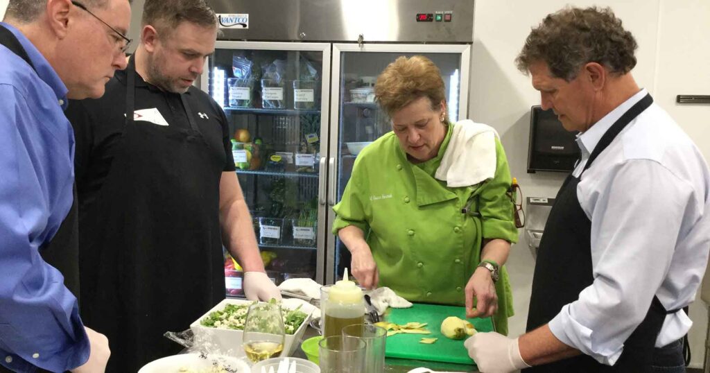 One of our world-class Atlanta cooking class instructors with participants.