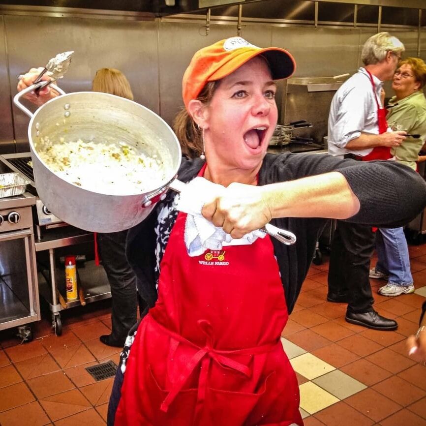 Showing what she's cooked in our culinary team building challenge!