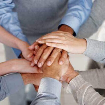 clasping-hands clasping hands | Team Building with Taste | teambuildingwithtaste.com